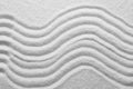 White sand with pattern as background, closeup. Concept of zen and harmony Royalty Free Stock Photo