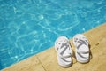 White sandals at the poolside Royalty Free Stock Photo