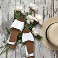 White sandals on a wooden background Royalty Free Stock Photo