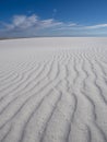 White Sands National Monument in Chihuahuan Desert under a blue cloudy sky in the US Royalty Free Stock Photo