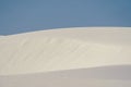 White Sands National Park - selective focus on second sand dune, against blue sky Royalty Free Stock Photo