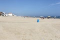 Desolated white sandy beach and blue sky in Oliva, Valencia, Spain