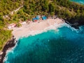 White sandy beach with coconut palms and crystal turquoise ocean in Bali. Aerial view Royalty Free Stock Photo