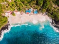 White sandy beach with coconut palms and crystal turquoise ocean in Bali. Aerial view Royalty Free Stock Photo