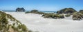 White sandy beach panorama with rocks Royalty Free Stock Photo