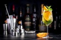 White sangria summer alcoholic drink with white spanish wine, peach, orange, lime and ice. Black bar counter background, steel bar Royalty Free Stock Photo