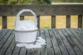 The White Satin Flower Girl Basket Wrapped with Burlap Ribbon Royalty Free Stock Photo