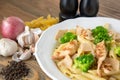 White sauce pasta with grilled chicken, black pepper, garlic and onion served in dish isolated on table side view of arabic food Royalty Free Stock Photo