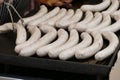 White sausages on a grill Royalty Free Stock Photo