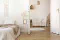 White scandinavian bedroom with door open to nursery Royalty Free Stock Photo