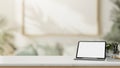 A white-screen digital tablet mockup on a white tabletop in a modern living room Royalty Free Stock Photo