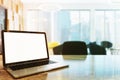 White screen laptop on an office table side toned Royalty Free Stock Photo