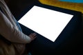 Woman using interactive empty white touchscreen display kiosk at exhibition Royalty Free Stock Photo