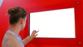 White screen concept - woman looking at blank white display wall at exhibition Royalty Free Stock Photo