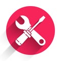 White Screwdriver and wrench spanner tools icon isolated with long shadow. Service tool symbol. Red circle button Royalty Free Stock Photo