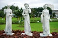 White sculptures on the grass