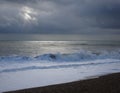 White sea foam rolling back and stormy sea