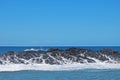 ROCKS WITH SEA WATER AND FOAM RUNNING OFF Royalty Free Stock Photo