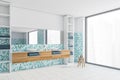 White and sea-green bathroom with white sinks, white tiled floor and window
