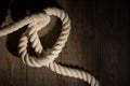 White sea rope on the wooden floor. Royalty Free Stock Photo