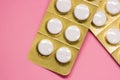 White sealed pill packages with pink background Royalty Free Stock Photo