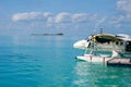 White seaplane on the turquoise maldivian lagoon. luxurious travel concept