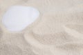 White seashell lying on sand beach surface macro with place for text Royalty Free Stock Photo