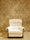 White seat on damasque wall Royalty Free Stock Photo