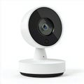A white security camera with a black lens and a round base on a white background in a studio setting Royalty Free Stock Photo