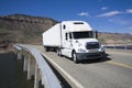 White Semi driving the bridge Royalty Free Stock Photo