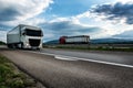 White semi trailer lorry truck passing on a highway at sunset Royalty Free Stock Photo