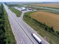 White semi trailer truck driving on straight highway to pertol station. view from above. The Don M4 route in Russia Royalty Free Stock Photo