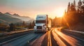 18 wheeler white American semi truck driving on highway at sunset Royalty Free Stock Photo