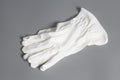 White service gloves on gray background