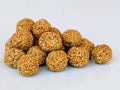 White sesame seed balls made with heated  jiggery against white background Royalty Free Stock Photo