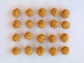 White sesame seed balls made with heated  jiggery against white background Royalty Free Stock Photo