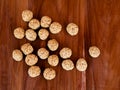 White sesame seed balls made with heated jiggery against wooden background Royalty Free Stock Photo