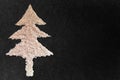 White sesame seed christmas Tree designed on black granite texture background with blank space. Top View Royalty Free Stock Photo