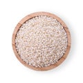 White sesame seeds in a wooden cup isolated on a white background. Top view Royalty Free Stock Photo
