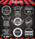 White set burger icons, labels, signs, symbols and badges on blackboard Royalty Free Stock Photo