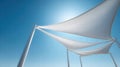 White shade sails against a bright blue sky Royalty Free Stock Photo
