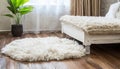 White shaggy carpet on brown wooden floor Royalty Free Stock Photo