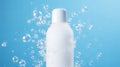 white shampoo bottle with soap bubbles on a plain blue background