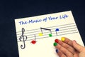 A white sheet of paper with a musical key and colorful finger prints