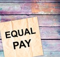 white sheet of paper with the text EQUAL PAY. Gender equality concept Royalty Free Stock Photo