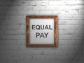 white sheet of paper with the text EQUAL PAY. Gender equality concept Royalty Free Stock Photo