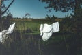 White sheets dry on a rope in nature Royalty Free Stock Photo