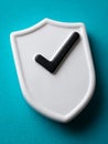 White shield with checkmark on teal background. Royalty Free Stock Photo
