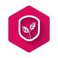 White Shield with leaf icon isolated with long shadow. Eco-friendly security shield with leaf. Pink hexagon button Royalty Free Stock Photo