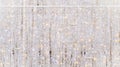 White shimmering Christmas garlands and string lights as a wall covering, used as event decoration. usable for a background